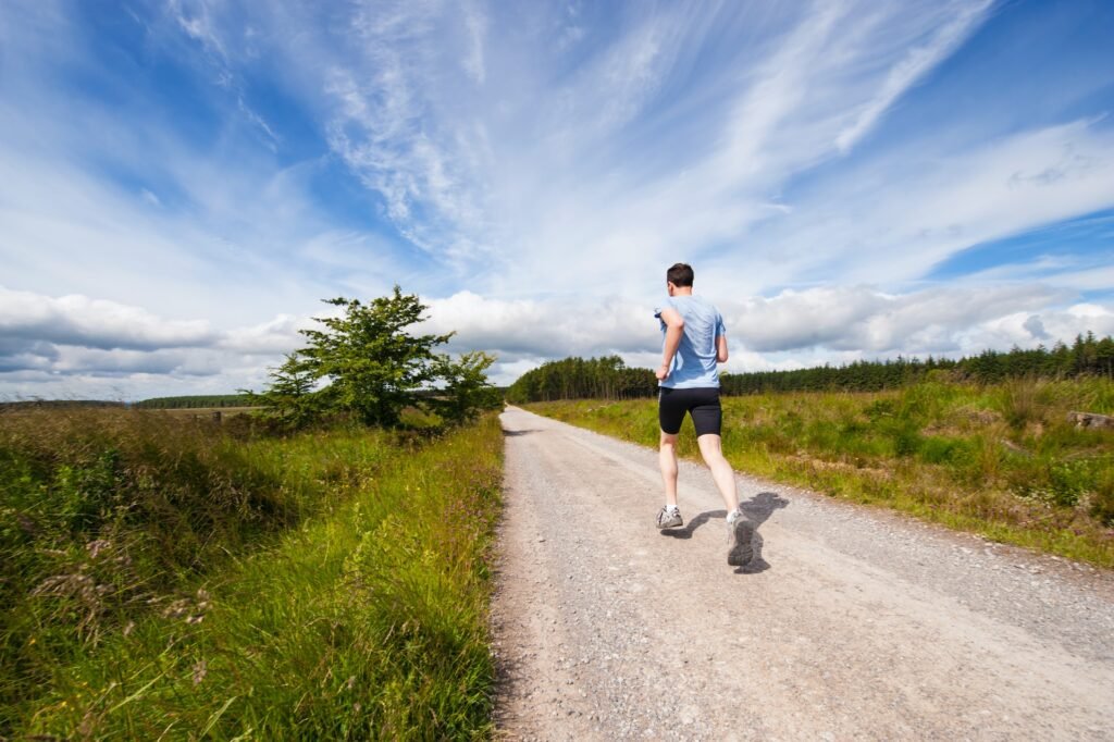 Picture of someone running.  Running is a cause of planatr fasciitis