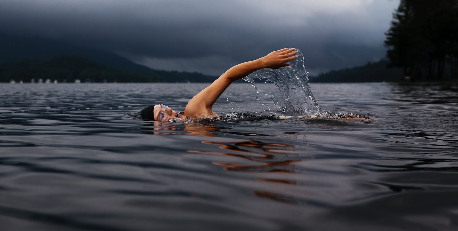 swimming in a lake. swimming can help with plantar fasciitis